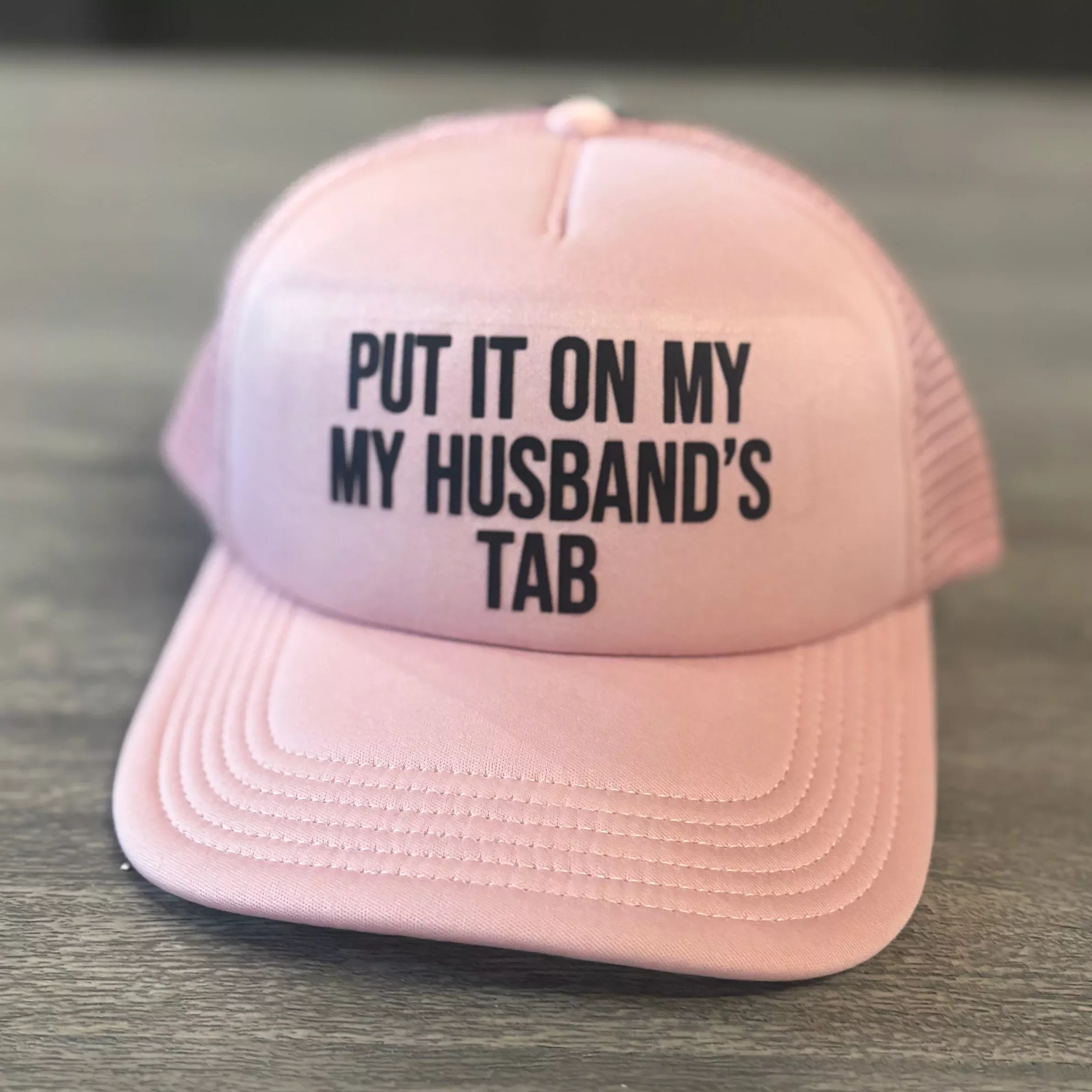 “Put It On My Husband’s Tab” Pink & Black Trucker Hat – Fun Snapback Cap